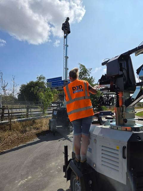 DJD Rentals engineer setting up a tower light mast on site