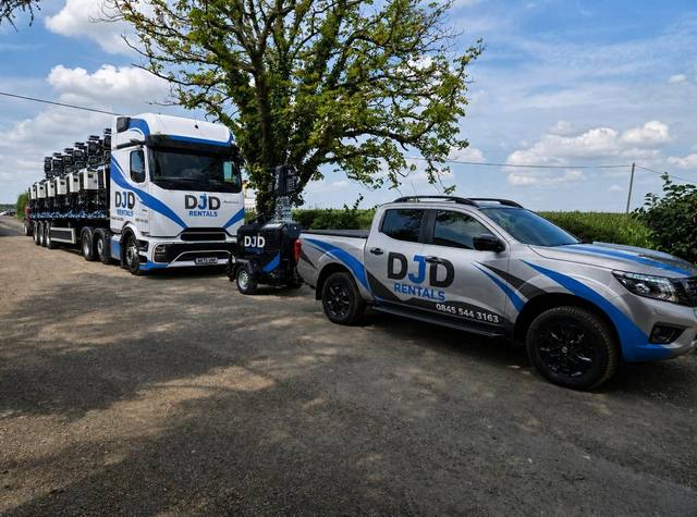 DJD Rentals lorry loaded with tower lights, with the pickup alongside