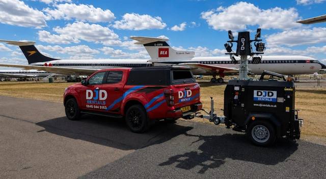 DJD Rentals pickup delivering a tower light to an airfield location