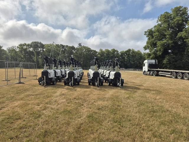 Tower light fleet delivered to an event field, with the DJD Rentals lorry behind
